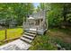 Large deck with stairs provides ample space for outdoor entertaining and relaxation at 6254 Grosbeak Ct, Nineveh, IN 46164