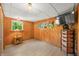 Finished basement with light floors, wood paneling and ample storage space at 6254 Grosbeak Ct, Nineveh, IN 46164
