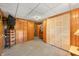 Finished basement features wood paneling, wood look floors, and closet space at 6254 Grosbeak Ct, Nineveh, IN 46164