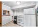 Unfinished basement features an ice machine, refrigerator, and tile floors at 6254 Grosbeak Ct, Nineveh, IN 46164