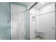 Bright bathroom featuring white subway tiles, a glass-enclosed shower, and stylish fixtures at 6254 Grosbeak Ct, Nineveh, IN 46164