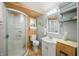 Bright bathroom with a glass-enclosed shower, white vanity, and neutral tones at 6254 Grosbeak Ct, Nineveh, IN 46164