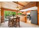 Open dining area features a scenic view, wood ceiling, and stainless steel appliances at 6254 Grosbeak Ct, Nineveh, IN 46164