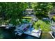 Dock with boat lift, patio furniture, and convenient lake access to lakeside home at 6254 Grosbeak Ct, Nineveh, IN 46164