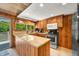 Kitchen boasts granite countertops, stainless steel appliances, and wood cabinetry at 6254 Grosbeak Ct, Nineveh, IN 46164