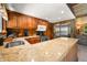 Kitchen with granite countertops, stainless steel appliances, and wood cabinetry at 6254 Grosbeak Ct, Nineveh, IN 46164