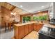 Well-equipped kitchen features wood cabinetry, granite countertops, and stainless steel appliances at 6254 Grosbeak Ct, Nineveh, IN 46164