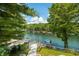 Picturesque lake view from the property featuring docks and lush greenery at 6254 Grosbeak Ct, Nineveh, IN 46164