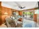 Living room with plush furniture and sliding door access to the deck at 6254 Grosbeak Ct, Nineveh, IN 46164