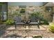 Charming stone patio provides a quaint seating area, framed by lush landscaping at 6254 Grosbeak Ct, Nineveh, IN 46164