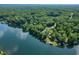 A lush, tree-lined coast offers beautiful waterfront properties at 6300 Grouse Dr, Nineveh, IN 46164