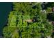 Aerial shot showcasing property lines around a house surrounded by lush trees at 6300 Grouse Dr, Nineveh, IN 46164