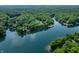 Expansive aerial view of lakefront properties surrounded by lush greenery and blue waters at 6300 Grouse Dr, Nineveh, IN 46164