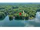 Captivating aerial view showcases lakefront homes surrounded by dense, mature trees at 6300 Grouse Dr, Nineveh, IN 46164