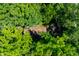 Aerial view of a charming house nestled amidst lush trees at 6300 Grouse Dr, Nineveh, IN 46164