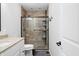 Modern bathroom features a glass enclosed shower, a toilet, and a vanity with a sink at 6300 Grouse Dr, Nineveh, IN 46164