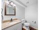 Well-lit bathroom with a granite countertop, ample counter space, and a modern toilet at 6300 Grouse Dr, Nineveh, IN 46164