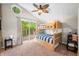 Bright bedroom features a wooden bunk bed, a window, and access to a walkout porch at 6300 Grouse Dr, Nineveh, IN 46164