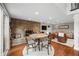 Basement dining area featuring a stone accent wall, comfortable seating, and natural light at 6300 Grouse Dr, Nineveh, IN 46164