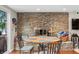 Dining room showcasing a stone fireplace and round table with seating for four at 6300 Grouse Dr, Nineveh, IN 46164