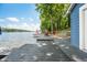 Scenic view of the lake from a wooden dock featuring a charming shed and cozy seating for relaxation and enjoyment at 6300 Grouse Dr, Nineveh, IN 46164