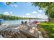 Beautiful lake view with relaxing dock and seating area on a sunny day at 6300 Grouse Dr, Nineveh, IN 46164