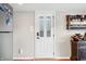 Interior doorway with white door and decorative glass and cabinet with bar accessories at 6300 Grouse Dr, Nineveh, IN 46164