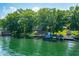 Picturesque lakefront home featuring a private dock and multiple boat lifts at 6300 Grouse Dr, Nineveh, IN 46164