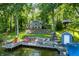Charming lake house with a private dock, lakeside patio, and inviting outdoor space at 6300 Grouse Dr, Nineveh, IN 46164