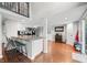 Bright kitchen featuring an island with seating and an open floorplan to the dining area at 6300 Grouse Dr, Nineveh, IN 46164