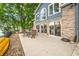 Outdoor patio of a lake home with serene waterfront views, complete with a dining set for al fresco enjoyment at 6300 Grouse Dr, Nineveh, IN 46164