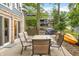 Outdoor patio with a dining table and chairs, offering beautiful backyard views at 6300 Grouse Dr, Nineveh, IN 46164