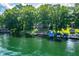 Charming waterfront home boasts a private dock and stunning lake views amidst verdant surroundings at 6300 Grouse Dr, Nineveh, IN 46164