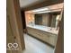 Bathroom featuring dual sinks, a large mirror, and ample cabinet space at 8577 One W Dr # 301, Indianapolis, IN 46260