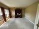 Neutral bedroom featuring built-in desk, window views, and neutral walls at 8577 One W Dr # 301, Indianapolis, IN 46260