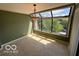 Bright dining area with large windows offering scenic views and ample natural light at 8577 One W Dr # 301, Indianapolis, IN 46260