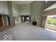 Bright living room featuring a fireplace, large windows, and neutral decor at 8577 One W Dr # 301, Indianapolis, IN 46260