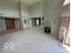 Spacious living room with high ceilings, fireplace, and ample natural light at 8577 One W Dr # 301, Indianapolis, IN 46260