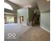 Open concept living space with staircase, large windows, and ample room for entertaining at 8577 One W Dr # 301, Indianapolis, IN 46260