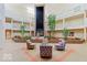 Bright lobby with stylish seating areas, a central water feature, and surrounding balconies, offering a welcoming space at 8577 One W Dr # 301, Indianapolis, IN 46260