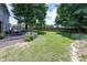 Lush backyard with a well-manicured lawn, patio, and privacy fence perfect for outdoor enjoyment at 12602 Lockerbie Cir, Carmel, IN 46033
