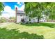 Expansive backyard featuring a well-maintained lawn, mature trees, and a cozy patio area for outdoor relaxation at 12602 Lockerbie Cir, Carmel, IN 46033
