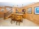 Finished basement featuring a custom wet bar with pendant lighting and seating, ideal for entertaining guests at 12602 Lockerbie Cir, Carmel, IN 46033