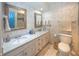 An elegantly designed bathroom with and sinks with marble counters at 12602 Lockerbie Cir, Carmel, IN 46033