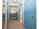 Hallway with blue doors, leading to a vanity and a well appointed bathroom at 12602 Lockerbie Cir, Carmel, IN 46033