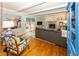 Cozy living room with beamed ceiling, fireplace, hardwood floors, and stylish decor at 12602 Lockerbie Cir, Carmel, IN 46033