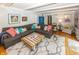 Comfortable living room with plush sectional, hardwood floors, and decorative accents at 12602 Lockerbie Cir, Carmel, IN 46033