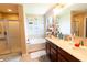 Bright bathroom featuring double sink vanity, soaking tub, shower, and stylish decorative accents at 1266 Hamilton Dr, Greenwood, IN 46143