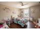 Cozy bedroom with a ceiling fan, wooden floors and lots of personalized decor at 1266 Hamilton Dr, Greenwood, IN 46143