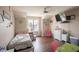 Sunlit bedroom with a ceiling fan and a large window for natural light, plus a television for entertainment at 1266 Hamilton Dr, Greenwood, IN 46143